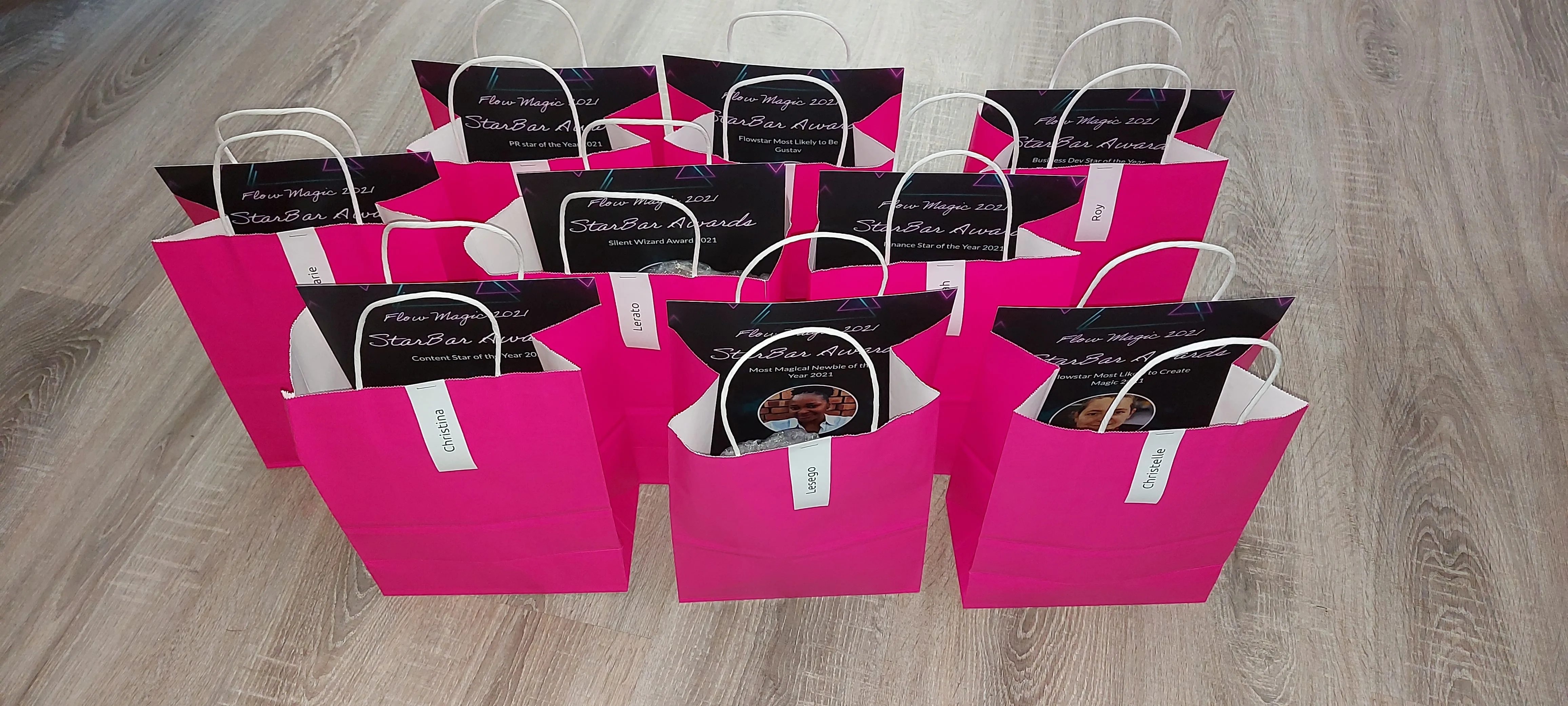 Staff who won awards at Flow’s year-end event received trophies and certificates.