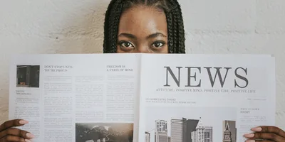 Woman reading newspaper 2025 02 10 12 58 13 utc 1